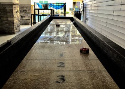 Nexus Luxury Apartments in Virginia Beach outdoor resident lounge with shuffleboard